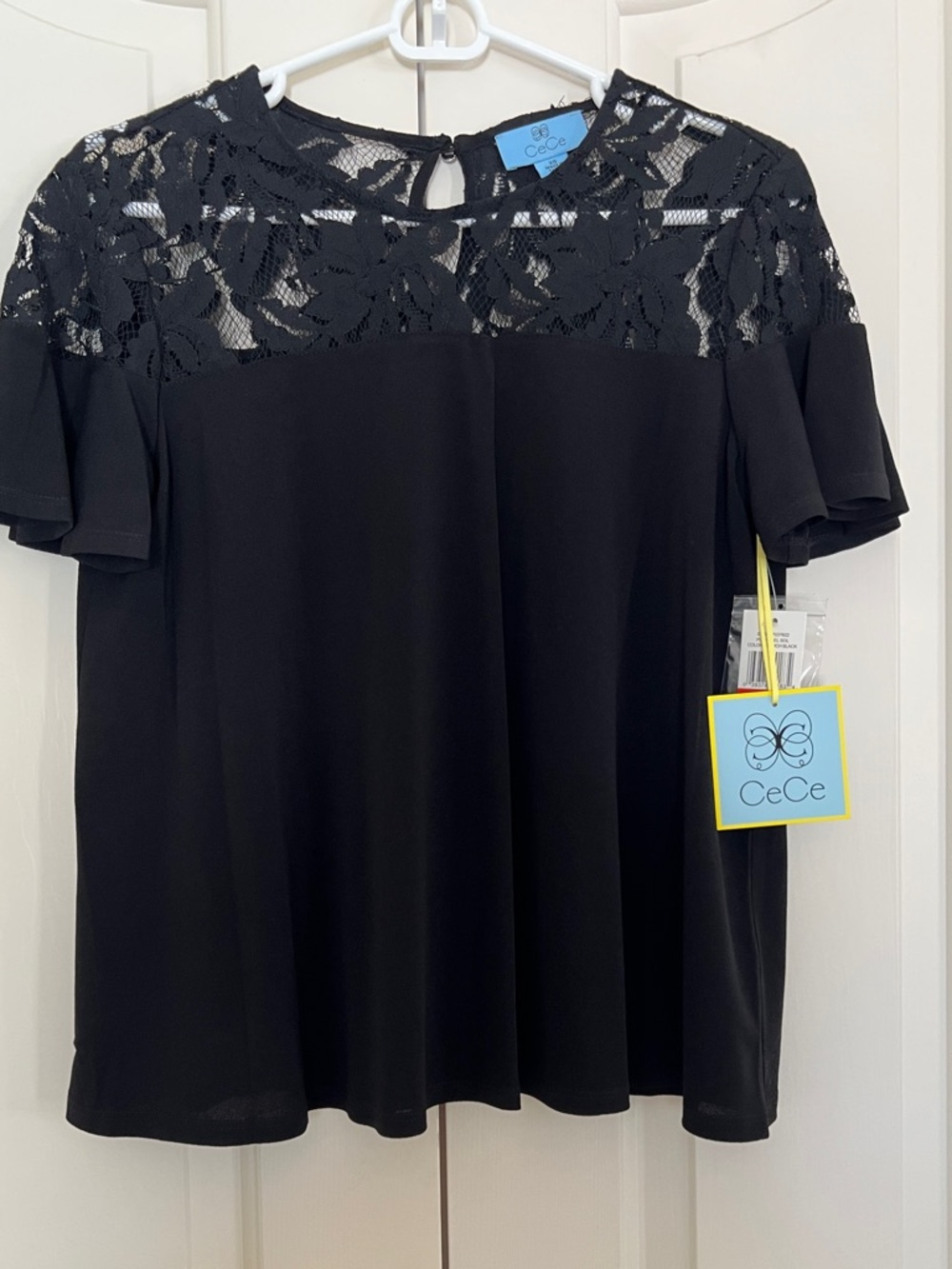 CeCe Black Lace Yoke Flutter Sleeve Top
Size XS